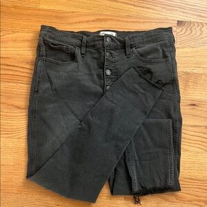Black straight leg jean with button and distressing details